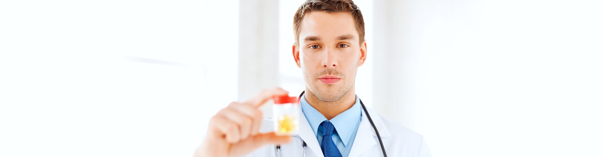 man holding medicine container
